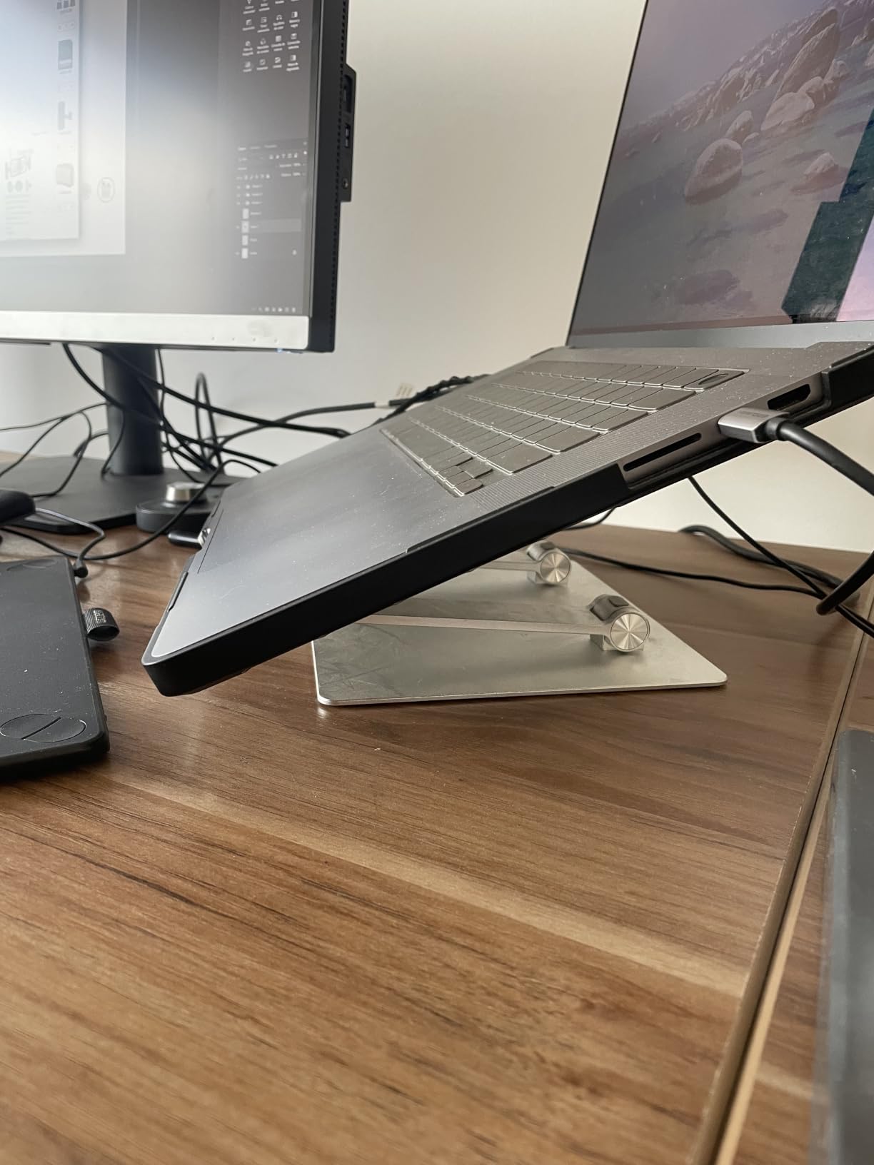 Amazon Basics Sturdy and Portable Ergonomic Laptop Stand for Desk, Height Adjustable Riser with Ventilated Cooling, Foldable, Fits all Laptops up to 15.6 Inch, Silver customer photo 2