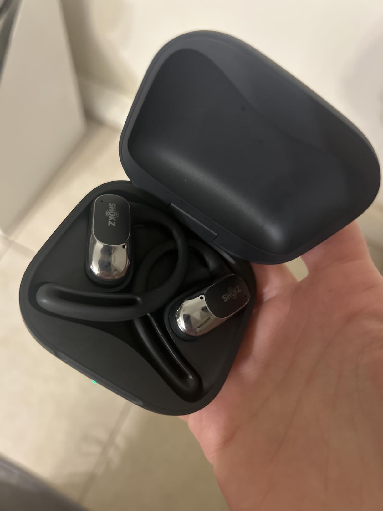 SHOKZ OpenFit Air - Open-Ear Headphones, True Wireless Earbuds, Water Resistant, Secure Earhooks for Daily Use, Black | Hooked comfort; Natural sound; Open-ear awareness; AI call clarity; IP54 customer photo 1
