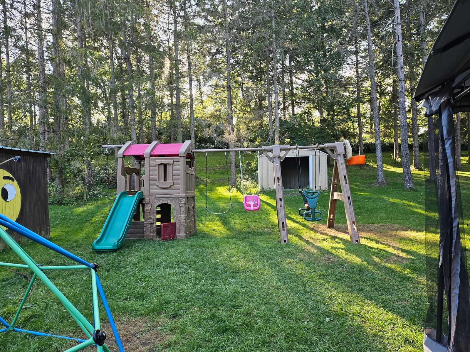 Step2 Naturally Playful Adventure Lodge Play Center with Glider, Kids Outdoor Playset, Two Tier Backyard Playground Set, Slide, Swings, Rope Ladder, Basketball Hoop, Jungle Gym, Children 3-8 Years Old customer photo 1