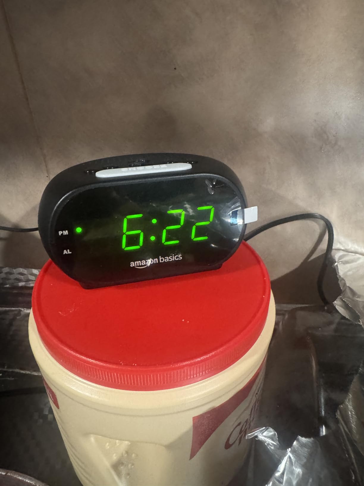 Amazon Basics Small Digital Oval Alarm Clock with LED Display, Nightlight, Snooze Function & Battery Backup, Black, 4.5 x 3.5 x 2.4 Inches customer photo 2