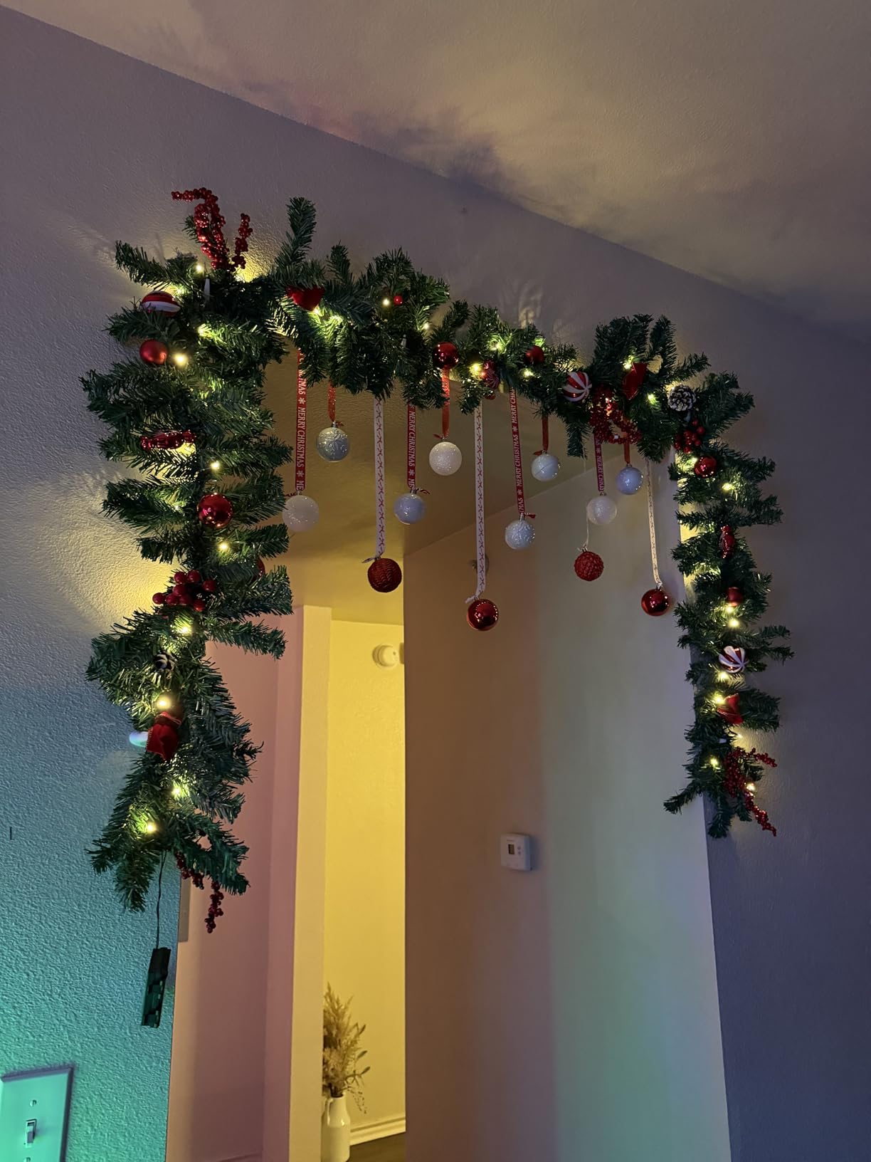 FUNPENY 9 FT Artificial Christmas Garland, Pre-Lit 50 LED Battery Operated Lighted Xmas Garland with 8 Modes for Indoor Holiday Door Home Decorations (Red) customer photo 2