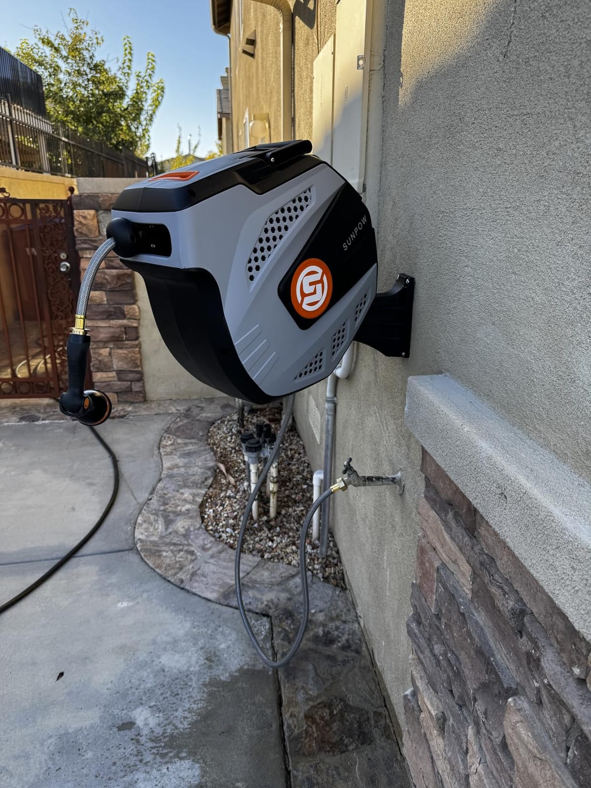 SUNPOW Retractable Garden Hose Reel - 1/2 inch x 50ft Heavy Duty Wall Mounted Hose Reel with 3/4 inch Brass Fitting & 10 Sprayer Nozzle - Any Length Lock, Auto Rewind System, 180°Swivel Bracket- Grey customer photo 1
