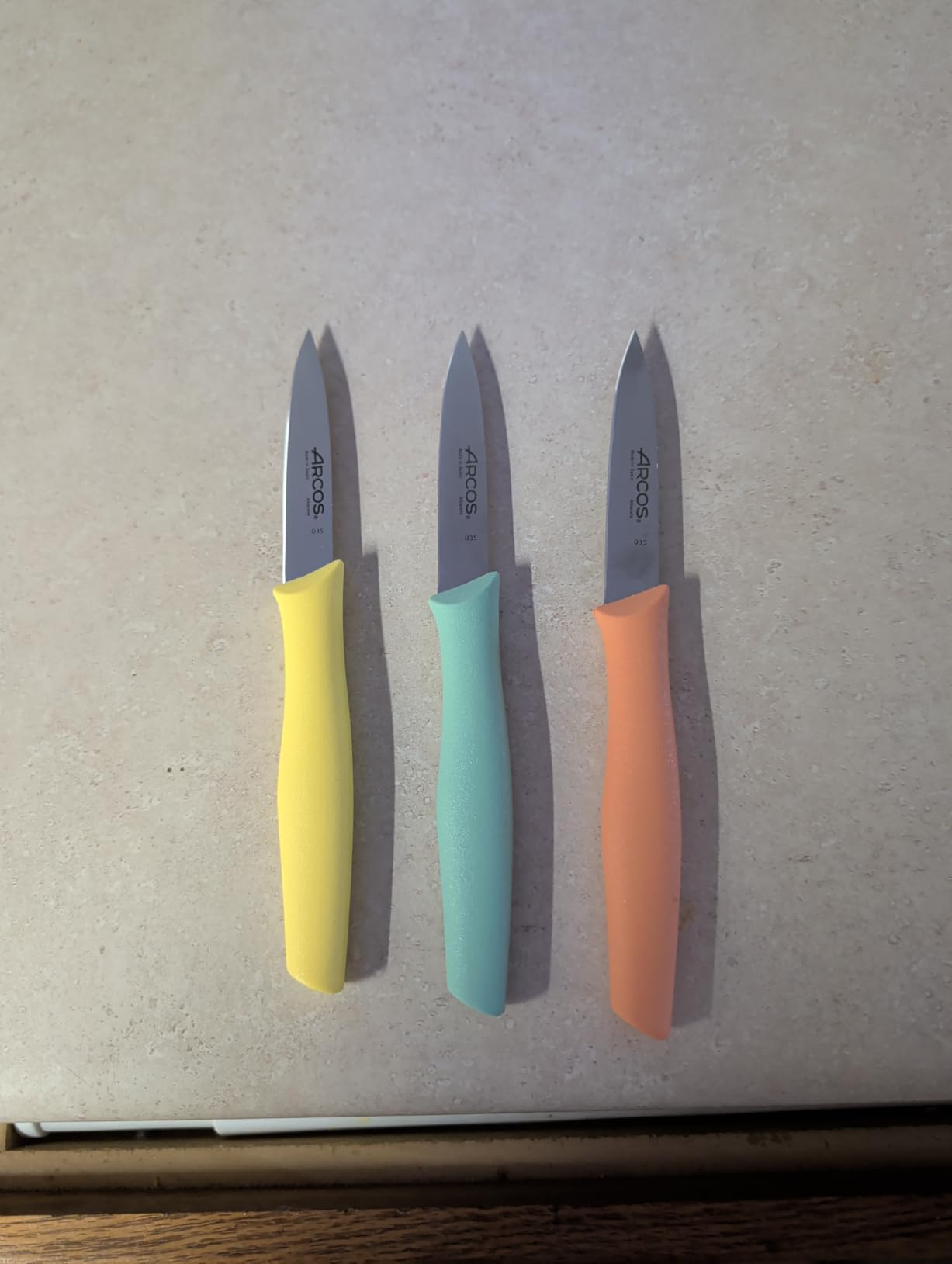 Arcos Paring Knife Set of 3 Pieces 4 Inch Stainless Steel. Colorful Kitchen Knives for Peeling Fruits and Vegetables. Ergonomic Polypropylene Handle. Series Nova. Color Orange, Yellow and Blue. customer photo 1